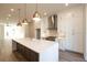 Open kitchen design with a spacious island, stainless steel appliances, and plenty of cabinet space at 205 Midnight Oak Run # 5, Alpharetta, GA 30009