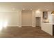 The living room area next to the kitchen shows hardwood floors and crown molding at 205 Midnight Oak Run # 5, Alpharetta, GA 30009