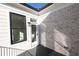 Cozy patio with dark wood floors, brick wall, and a stylish exterior light at 205 Midnight Oak Run # 5, Alpharetta, GA 30009