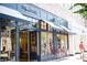 Eye-level view of a modern Madewell storefront with awnings and big windows at 205 Midnight Oak Run # 5, Alpharetta, GA 30009