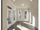 Bright sunroom with large windows offering plenty of natural light and views of the neighborhood at 205 Midnight Oak Run # 5, Alpharetta, GA 30009
