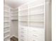 Organized walk-in closet with white shelving and drawers maximizing storage space at 205 Midnight Oak Run # 5, Alpharetta, GA 30009