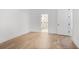 Bright bedroom featuring hardwood floors and a doorway leading into the ensuite bathroom at 419 Southland Cir, Canton, GA 30115
