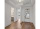 Bright entryway with hardwood floors, featuring a tray ceiling, and views to the bathroom and dining area at 419 Southland Cir, Canton, GA 30115