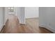 Hallway featuring light hardwood flooring, white trim, and leads to the other rooms at 419 Southland Cir, Canton, GA 30115