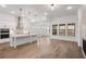Spacious kitchen with white cabinets, stainless steel appliances, a large island, and hardwood floors at 419 Southland Cir, Canton, GA 30115