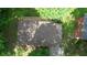 Aerial view of the house showing roof and backyard deck with surrounding trees at 50 Woodland St, Buford, GA 30518