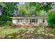 Traditional home with a well-maintained front yard and inviting curb appeal at 50 Woodland St, Buford, GA 30518