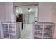 Bright, tiled kitchen featuring stainless steel appliances and a door leading outside at 50 Woodland St, Buford, GA 30518