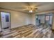 Spacious living room featuring wood-look flooring, neutral paint, and natural light at 50 Woodland St, Buford, GA 30518