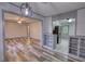 Open-concept living room flows into dining area with a view of the kitchen and its stainless steel appliances at 50 Woodland St, Buford, GA 30518