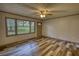 Living room showcasing stylish wood floors and a cozy atmosphere with natural light at 50 Woodland St, Buford, GA 30518