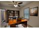 Office space with built-in shelving, a large desk, and a comfortable executive chair at 50 Woodland St, Buford, GA 30518