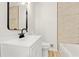 Bathroom featuring modern fixtures, wood-look flooring, and marble-style shower surround at 120 Ingleside Dr, Jonesboro, GA 30236