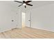 Bright bedroom featuring wood floors, a ceiling fan, and white trim at 120 Ingleside Dr, Jonesboro, GA 30236