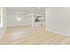 Bright and airy living room with light wood floors and ample natural light pouring through large windows at 120 Ingleside Dr, Jonesboro, GA 30236