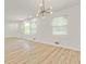 Spacious living room featuring recessed lighting, neutral paint, wood floors, and large bright windows at 120 Ingleside Dr, Jonesboro, GA 30236