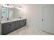 Elegant bathroom with double vanity, modern fixtures, marble countertops, and tile flooring at 2463 Whites Rdg, Decatur, GA 30034