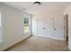 Bright bedroom featuring neutral carpet, a large closet, and a window with natural light at 2463 Whites Rdg, Decatur, GA 30034