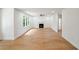Bright, open living room with hardwood floors, fireplace, large windows offering view of greenery, and recessed lighting at 2463 Whites Rdg, Decatur, GA 30034