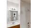 A bathroom has a single sink, shower and mirror at 3827 Shenfield Dr, Union City, GA 30291