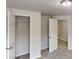 Bedroom with neutral carpet, closet with sliding doors, and overhead lighting at 3827 Shenfield Dr, Union City, GA 30291