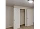 Bedroom with neutral carpet, closet with sliding doors, and overhead lighting at 3827 Shenfield Dr, Union City, GA 30291