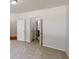 A well-lit bedroom with multiple entrances and soft carpeting at 3827 Shenfield Dr, Union City, GA 30291