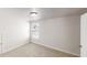 Bedroom with neutral carpeting and paint, window with blinds, and overhead lighting at 3827 Shenfield Dr, Union City, GA 30291