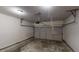 Empty two-car garage space showcasing concrete flooring and an automated door opener at 3827 Shenfield Dr, Union City, GA 30291