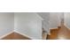 View of the entry hallway featuring hardwood floors, a carpeted stairway, and neutral walls at 3827 Shenfield Dr, Union City, GA 30291
