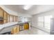 Bright kitchen features stainless steel appliances, wood cabinets, and an adjacent living area at 3827 Shenfield Dr, Union City, GA 30291
