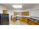 Spacious kitchen with wood cabinets, laminate countertops, and an electric oven at 3827 Shenfield Dr, Union City, GA 30291