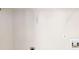 Unfinished laundry room with basic utility hookups and shelving for storage at 3827 Shenfield Dr, Union City, GA 30291