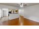 Open-concept living area with a kitchen view, hardwood floors, and ample natural light at 3827 Shenfield Dr, Union City, GA 30291