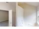 Bathroom featuring a tub, window, and entrance to the bedroom at 4162 Ward Lake Trl, Ellenwood, GA 30294