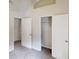 Bedroom with light colored walls, carpet, and closet with shelves at 4162 Ward Lake Trl, Ellenwood, GA 30294