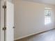 Bedroom with light colored walls, carpet, and a window with blinds at 4162 Ward Lake Trl, Ellenwood, GA 30294