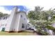 Exterior of home, showing back patio, siding, and chimney at 4162 Ward Lake Trl, Ellenwood, GA 30294