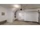 The garage has clean, painted walls and an access door to the home's interior at 4162 Ward Lake Trl, Ellenwood, GA 30294