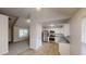 Modern kitchen featuring stainless steel appliances, granite countertops, tile flooring, and easy access to the living area at 4162 Ward Lake Trl, Ellenwood, GA 30294