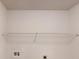 Wall in laundry room with wire shelving and utility hookups at 4162 Ward Lake Trl, Ellenwood, GA 30294