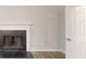 Bright living room shows a fireplace and wood-look flooring at 4162 Ward Lake Trl, Ellenwood, GA 30294