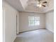 Spacious main bedroom with tray ceiling, ceiling fan, and large window at 4162 Ward Lake Trl, Ellenwood, GA 30294