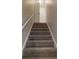 Carpeted stairs lead to the upper level of the home at 4162 Ward Lake Trl, Ellenwood, GA 30294