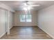 Spacious finished basement featuring vinyl plank flooring, support beams and natural light at 5574 Oak Grove Dr, Acworth, GA 30102