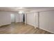 Finished basement with vinyl plank flooring, neutral walls, and modern ceiling fan at 5574 Oak Grove Dr, Acworth, GA 30102