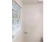 Bright white bathroom with a window, towel rack, and updated flooring at 5574 Oak Grove Dr, Acworth, GA 30102