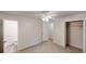 Bright bedroom with a ceiling fan, carpet floors, and doors to the bathroom and closet at 5574 Oak Grove Dr, Acworth, GA 30102