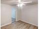 Bright bedroom featuring a ceiling fan, neutral walls, and vinyl plank flooring at 5574 Oak Grove Dr, Acworth, GA 30102
